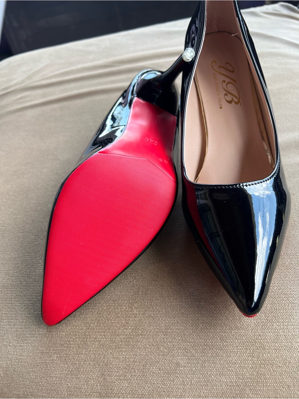 Black Patent Pointed-Toe Stiletto Pumps with Red Sole and Pearl Heel
